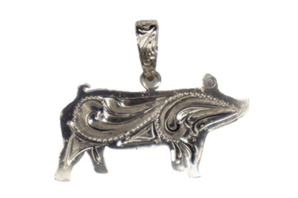 A silver pendant in the shape of a pig