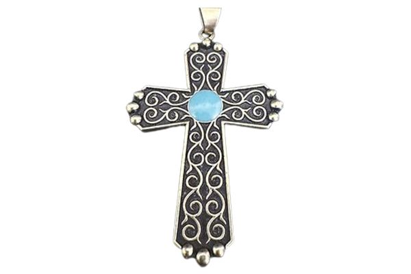 A cross with a blue stone in the middle on a white background.