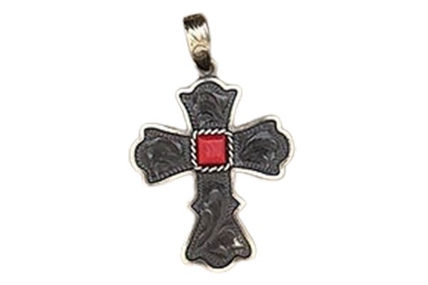A cross pendant with a red stone in the middle on a white background.