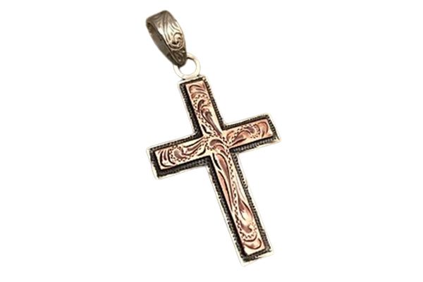 A close up of a cross pendant on a white background.
