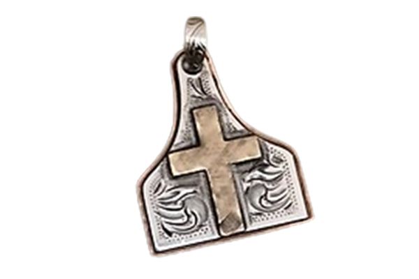 A silver pendant with a cross on it