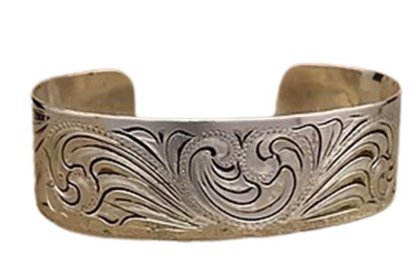 A silver bracelet with a floral design on it on a white background.
