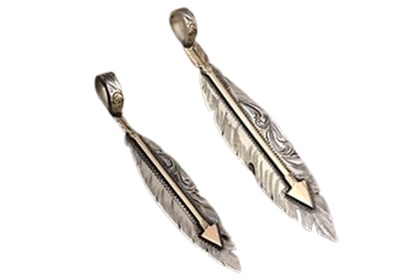 Two feather pendants with an arrow on them on a white background.