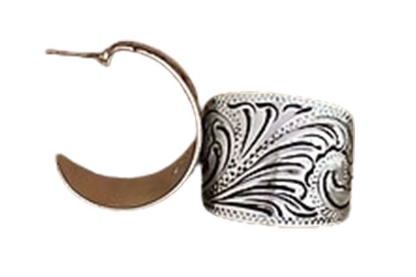 A pair of silver hoop earrings with a floral design on them.