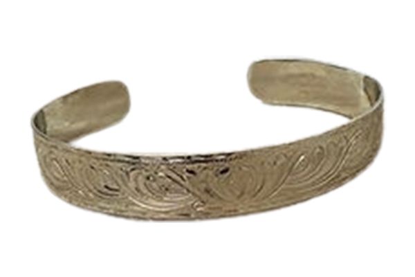 A silver bracelet with a floral design on it