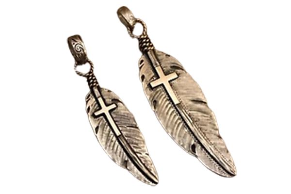 Two silver feathers with crosses on them on a white background