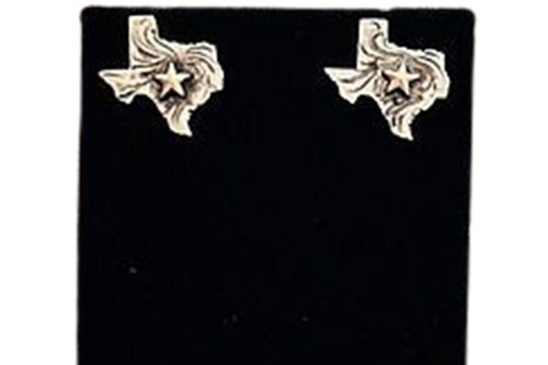 A pair of texas earrings are sitting on a black display case.