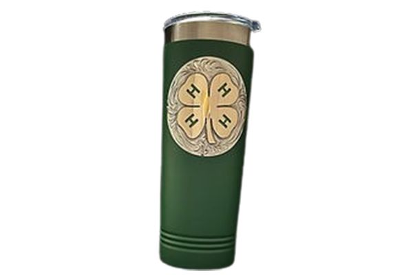 A green tumbler with a four leaf clover on it.