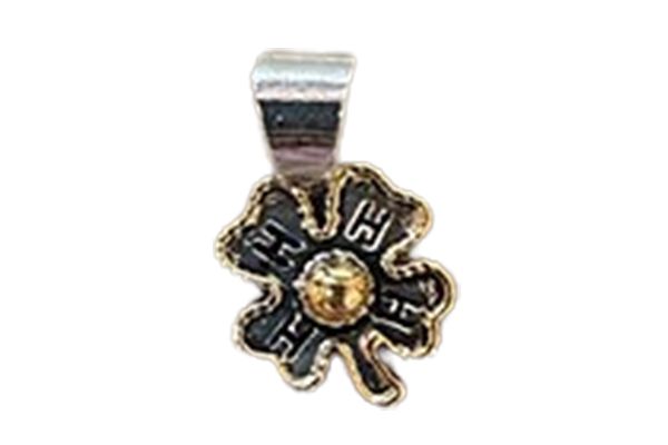A close up of a four leaf clover pendant on a white background.
