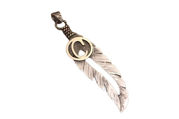 A feather pendant with a letter c on it on a white background.