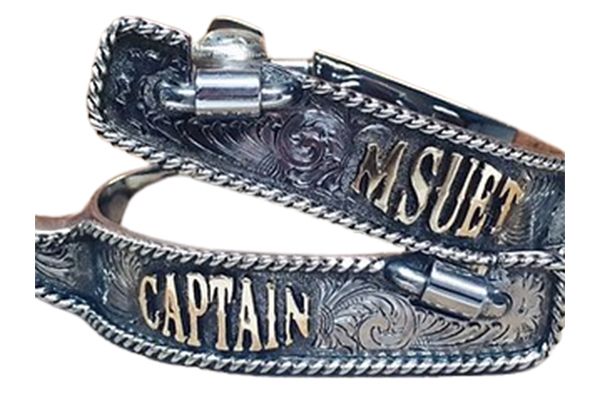 A pair of spurs with the name captain written on them.