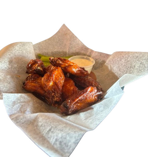 A basket of chicken wings with a side of dipping sauce
