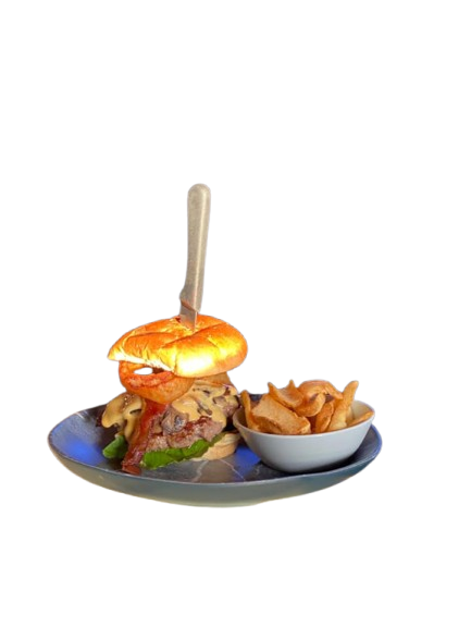 A hamburger and french fries on a plate with a fork.