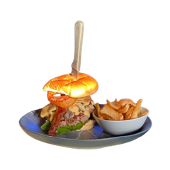 A hamburger and french fries on a plate with a fork.
