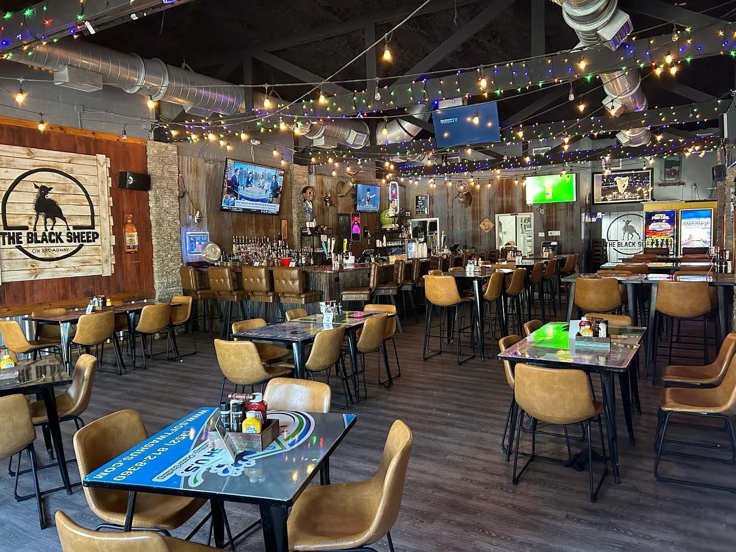 There are many tables and chairs in the restaurant.