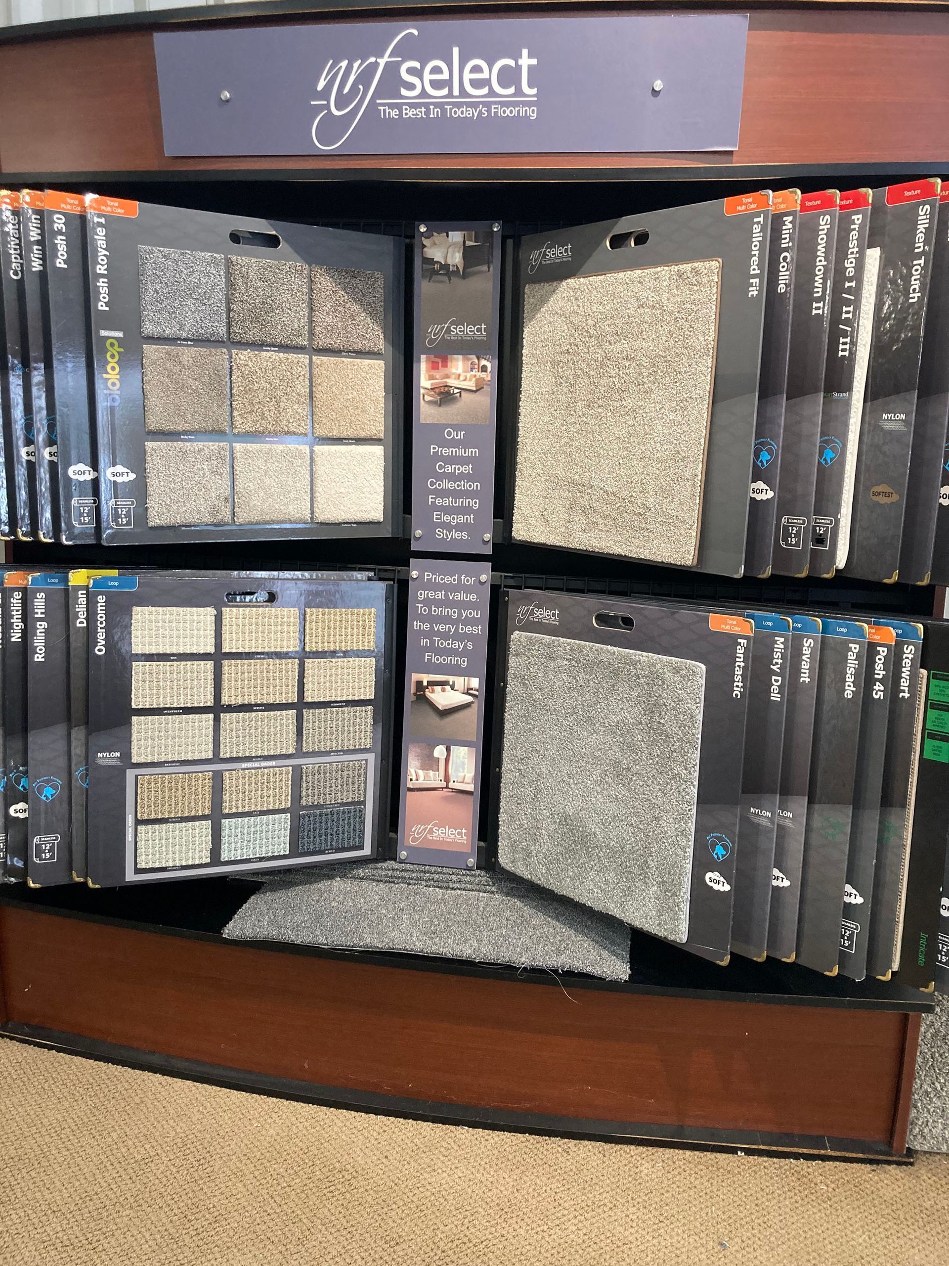 A display of carpets with a sign that says select