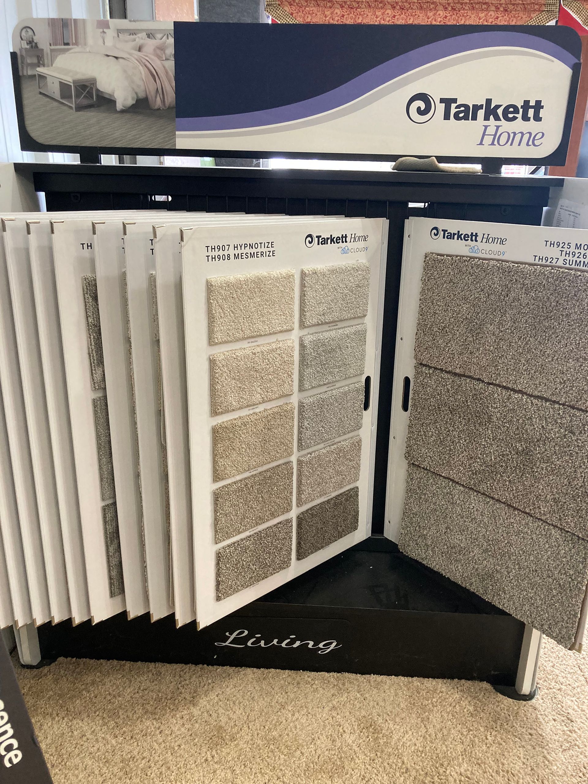 A display of carpets and tiles in a store.