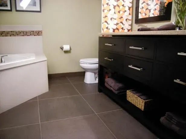 A bathroom with a toilet a sink and a bathtub