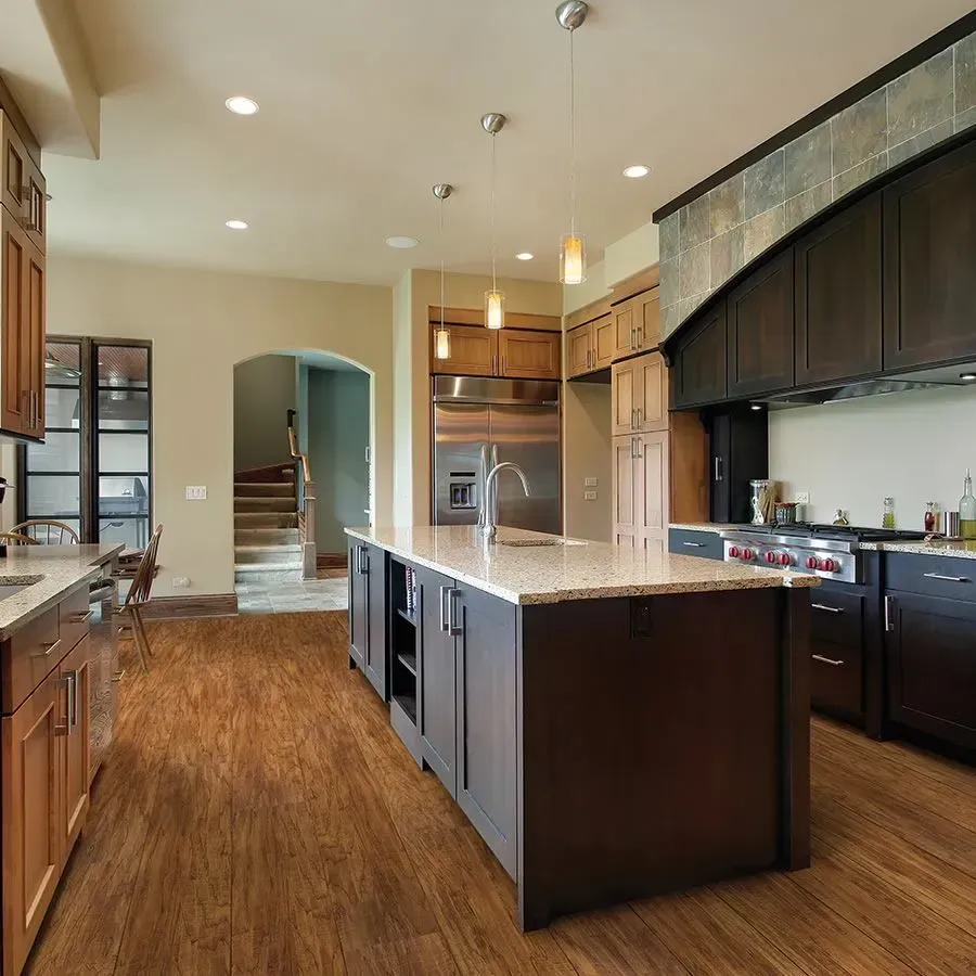 A kitchen with a large island in the middle