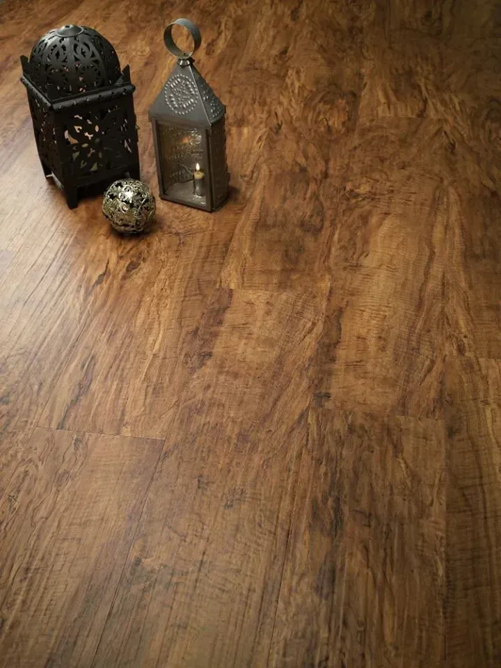 A wooden floor with a lantern and a ball on it.