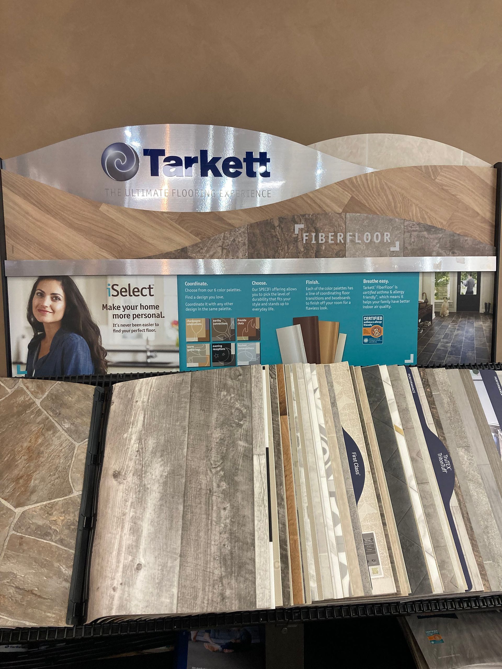 A display of tiles and a sign that says terkett