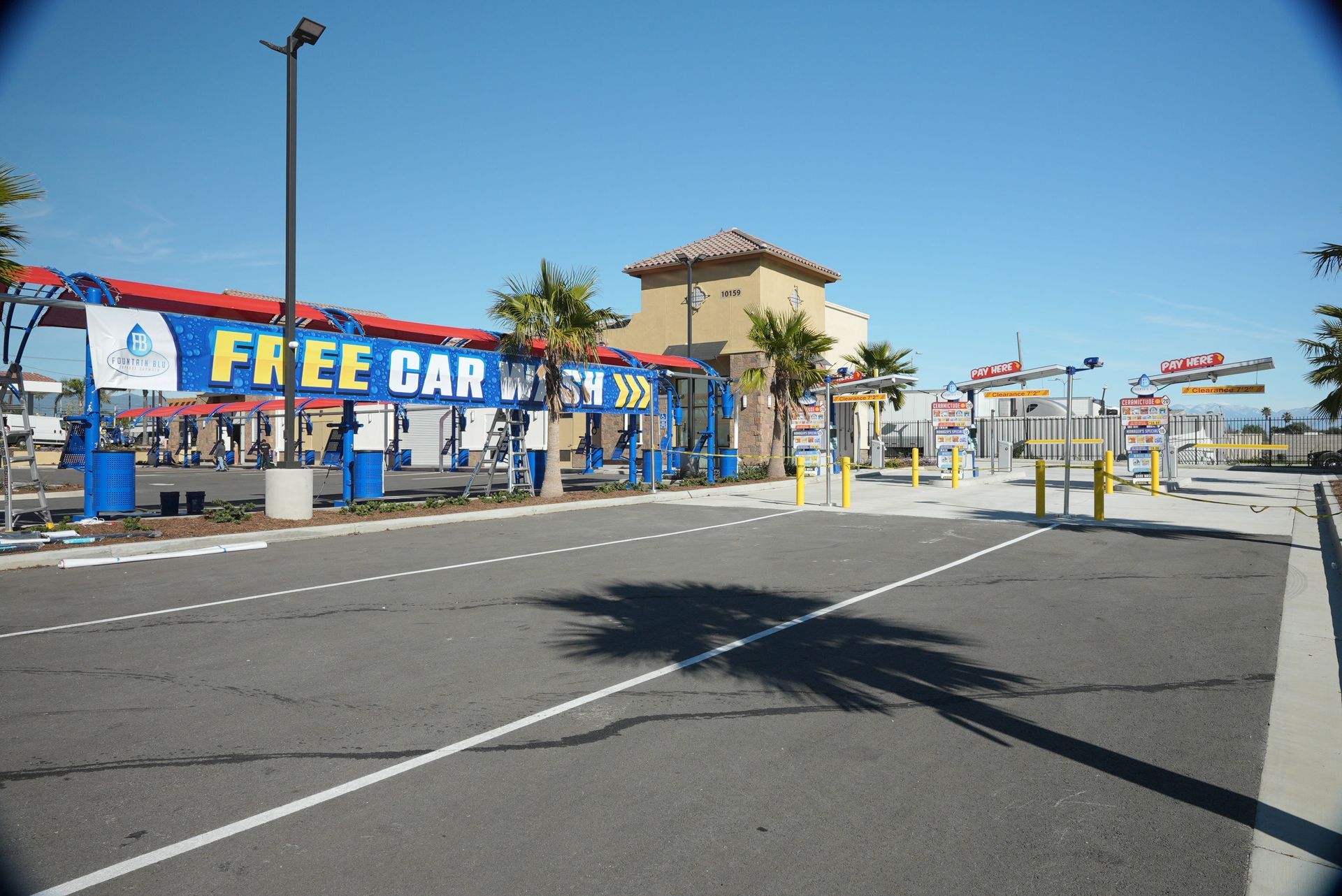A free car wash is located in a parking lot