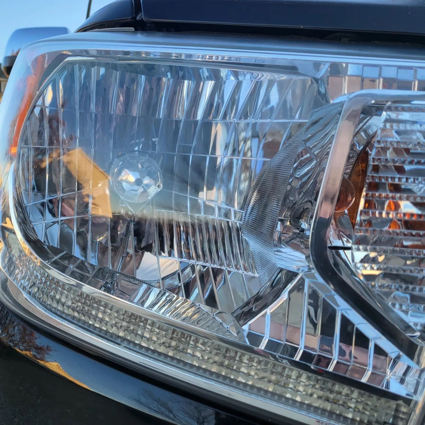 A close up of a headlight on a car