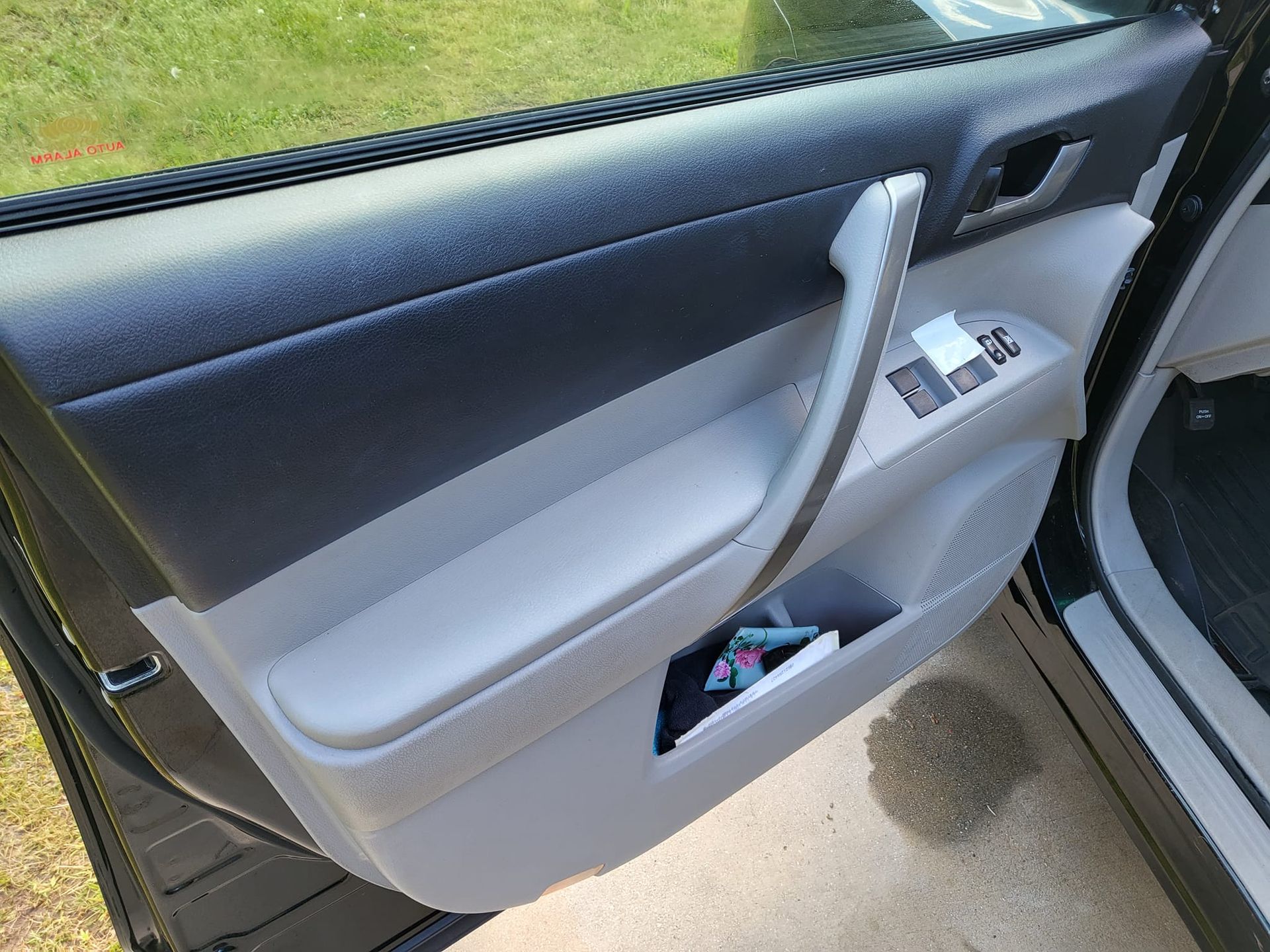 A close up of a car door with the door open