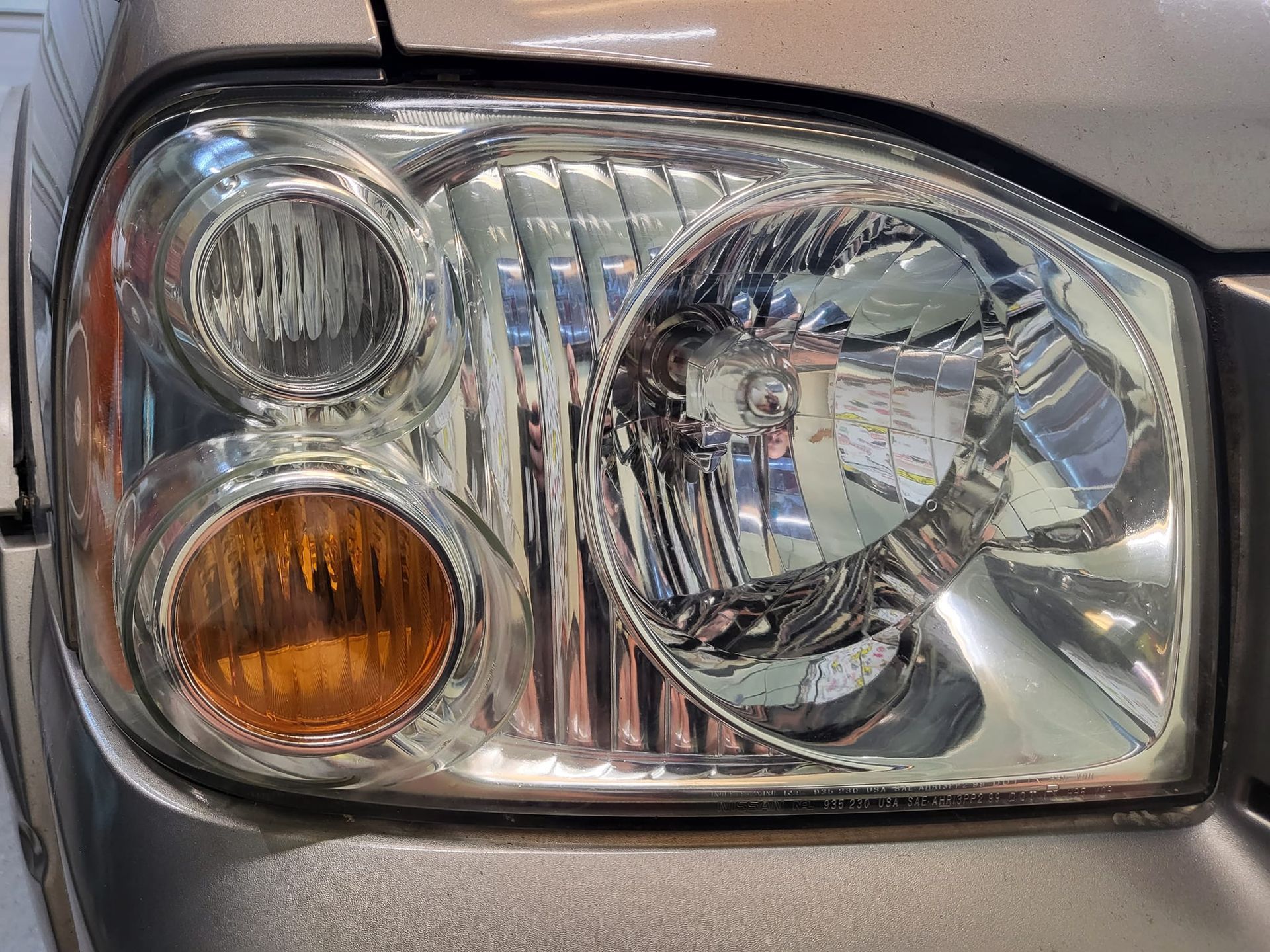 A close up of the headlight of a car