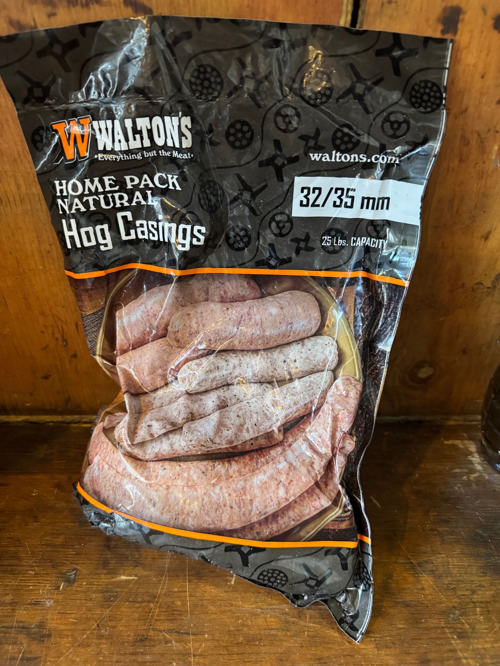 A bag of hog casings is sitting on a wooden table.