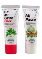Two tubes of GC MI Paste Plus and MI Paste toothpaste; one red and one white.