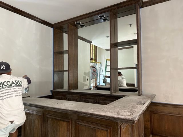 Man sanding a countertop
