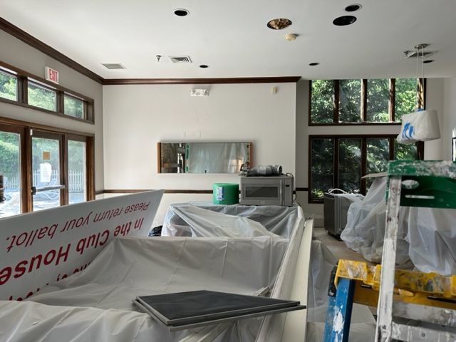 Furnitures covered in plastic to avoid new paint