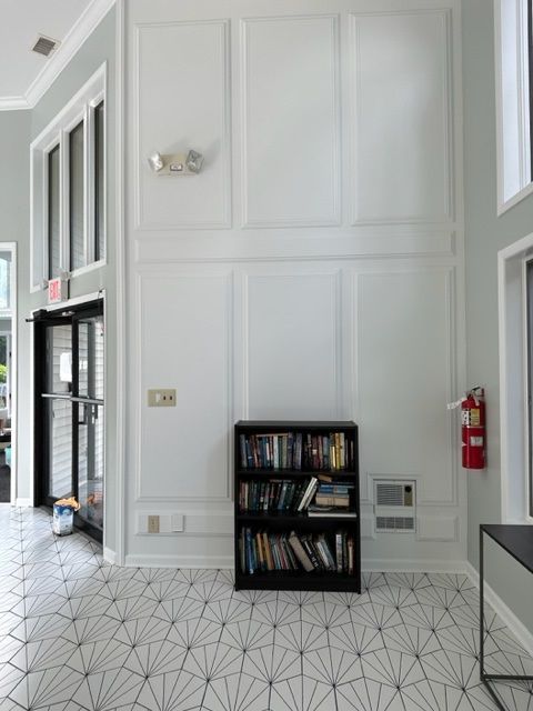 White wall with a small bookshelf