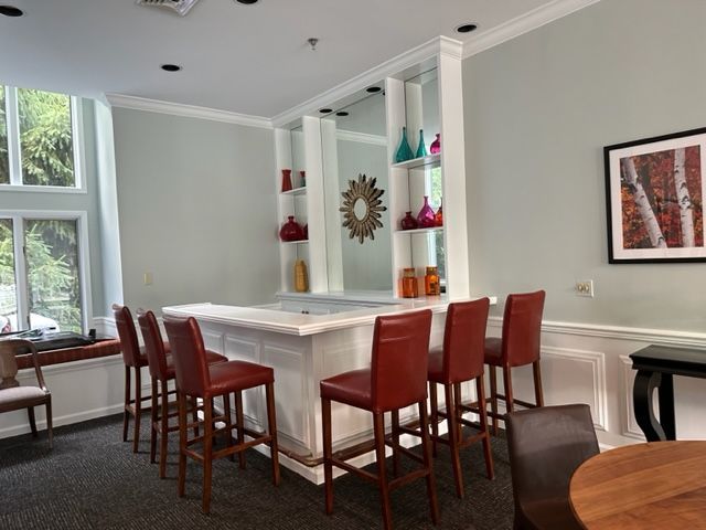 Bar with six chairs around it