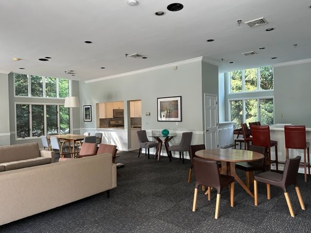 Room with sofa, tables, and chairs