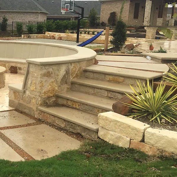 Leuders limestone patio bench and firepit