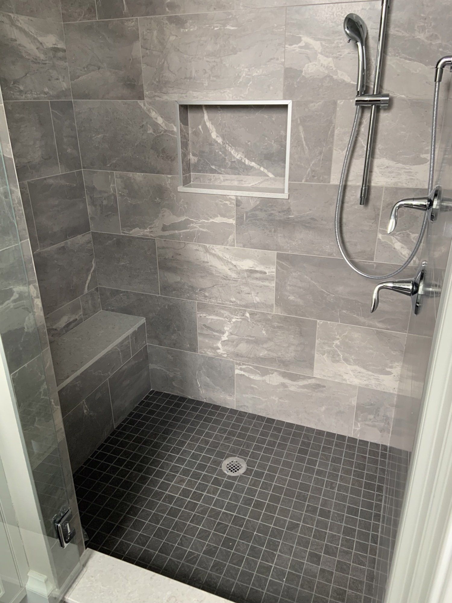shower with gray tiles