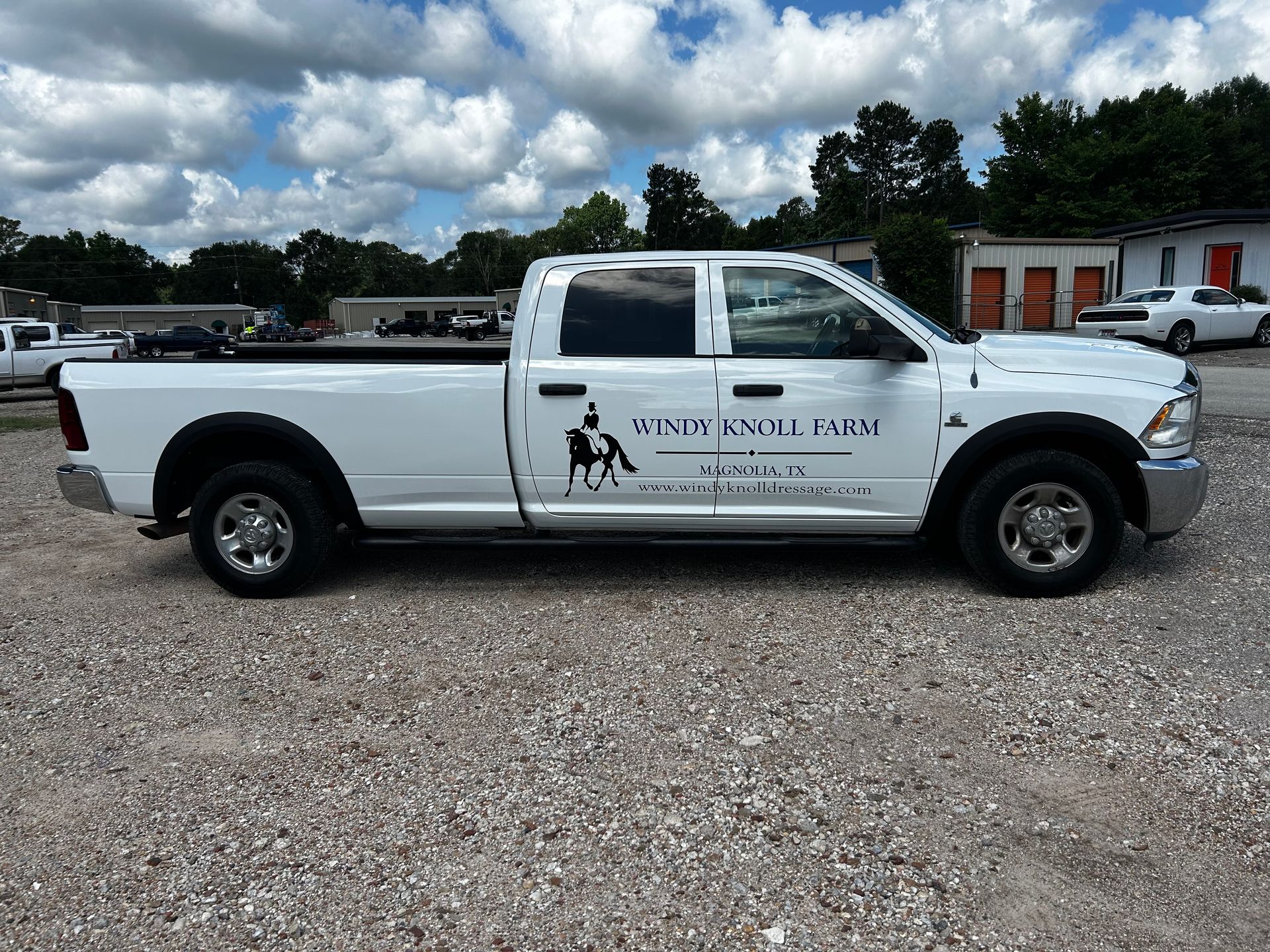 White pickup truck with logo 