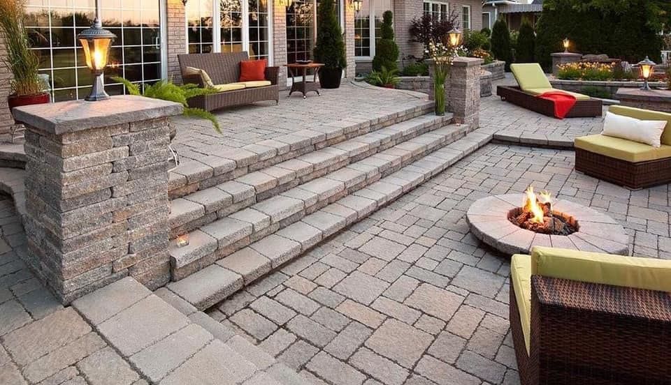 There is a fire pit in the middle of the patio.