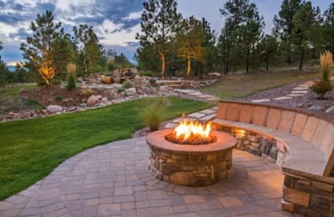 There is a fire pit in the middle of the patio.