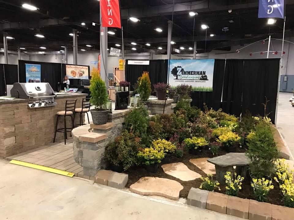 A large room filled with lots of plants and flowers.