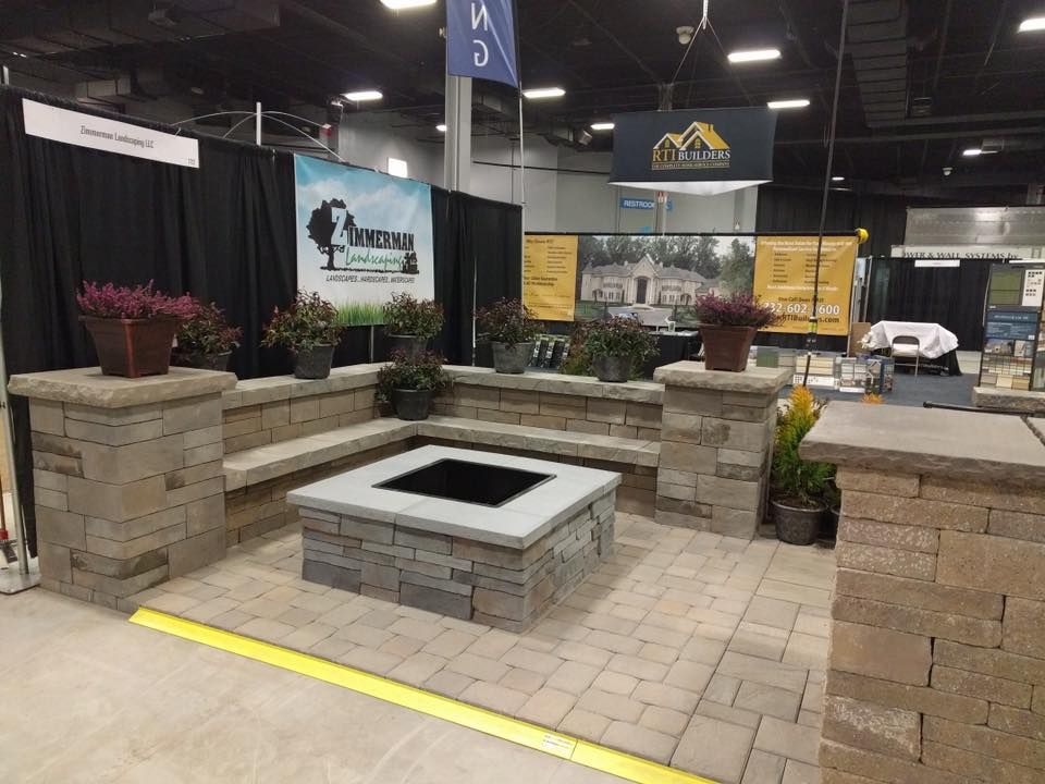 A room with a fire pit in the middle of it