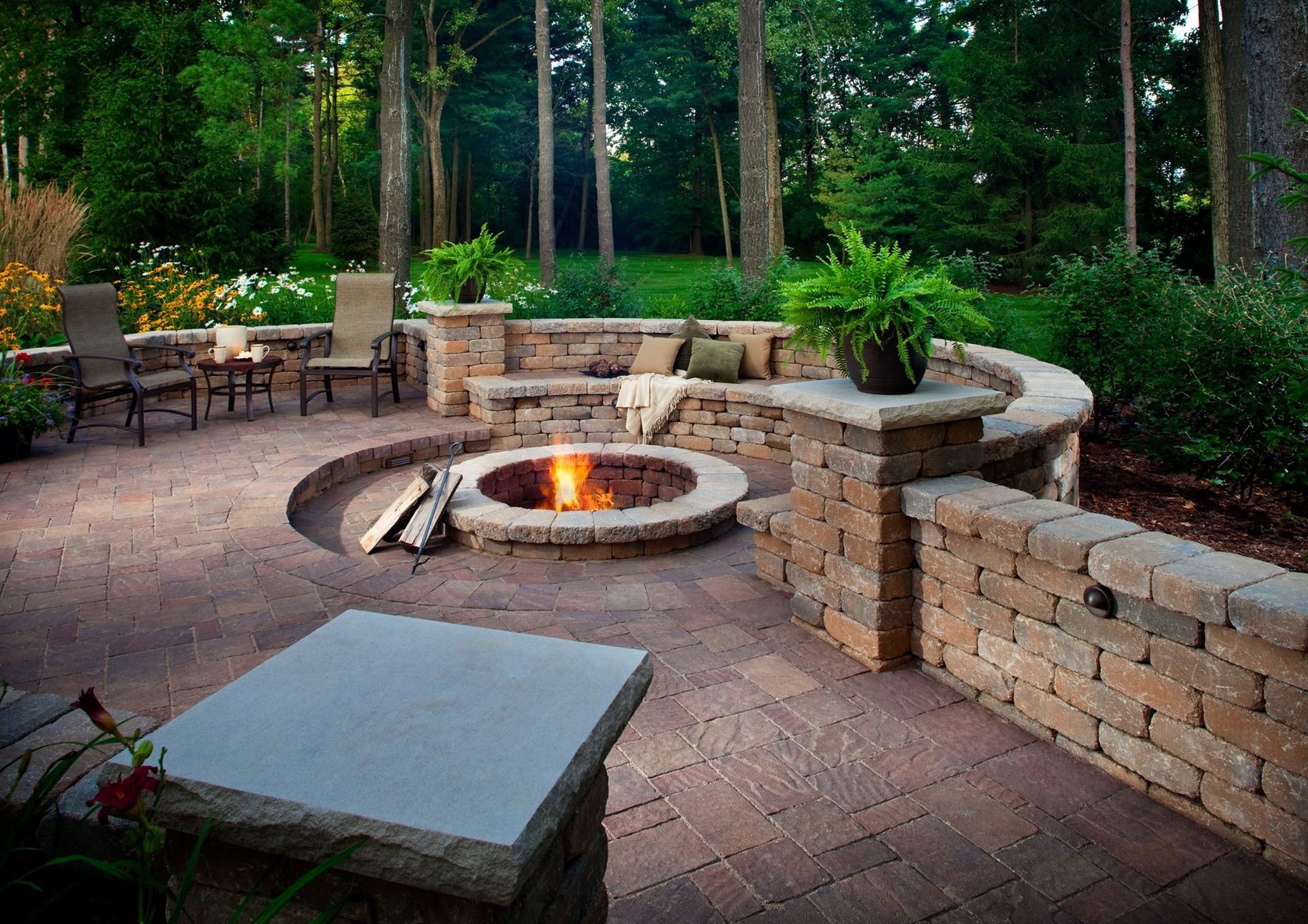 There is a fire pit in the middle of the patio.