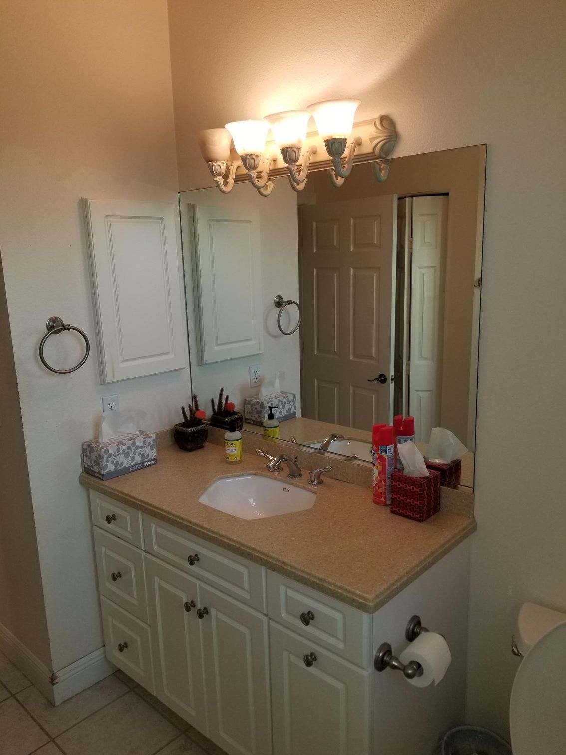 A bathroom with a sink and mirror