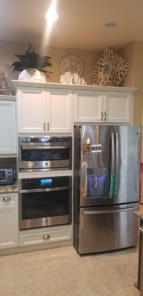 old cabinets above the oven and refrigerator