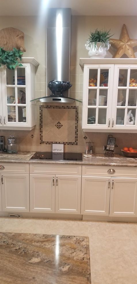 old cabinets and backsplash by the stove