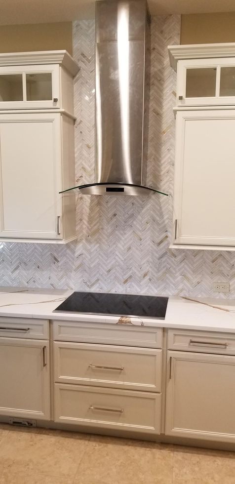 new cabinets and backsplash by the stove