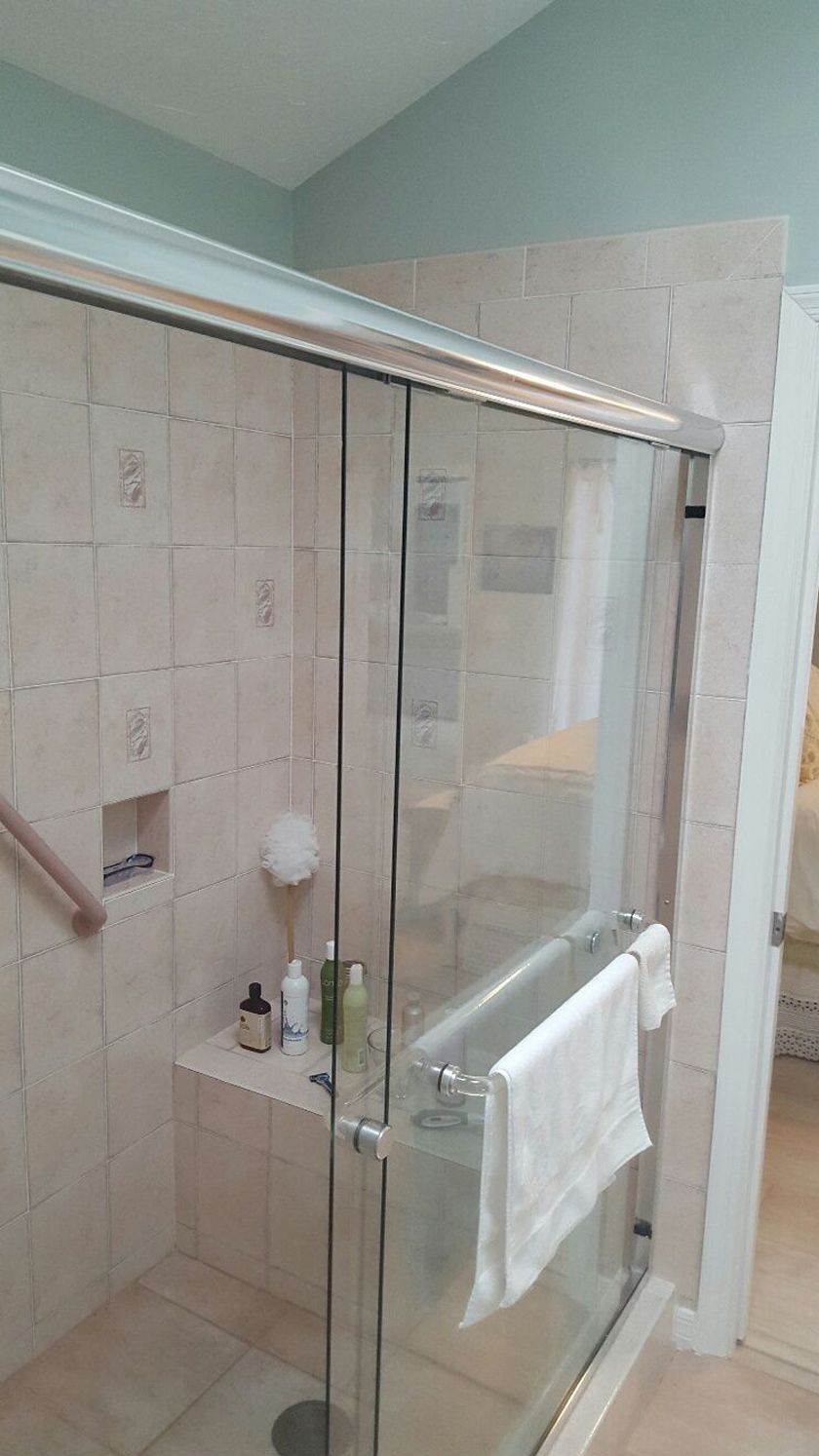 A bathroom with a walk in shower