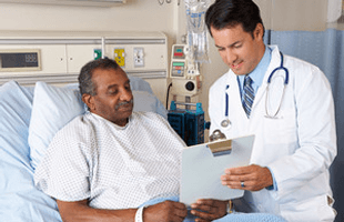 Doctor explaining consent form to senior patient